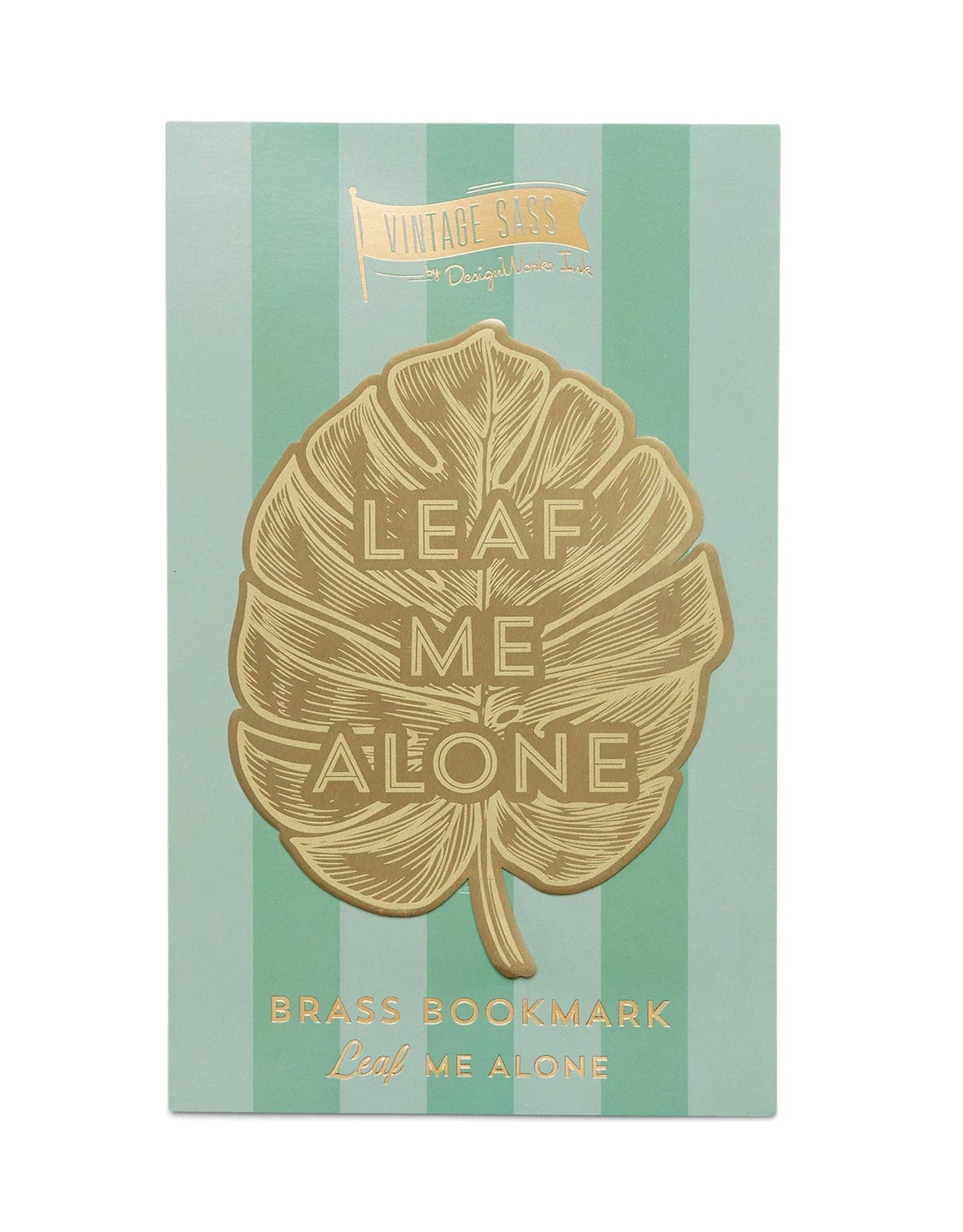 image of a brass bookmark in the shape of a leaf. etched in the centre of the leaf are the words leaf me alone