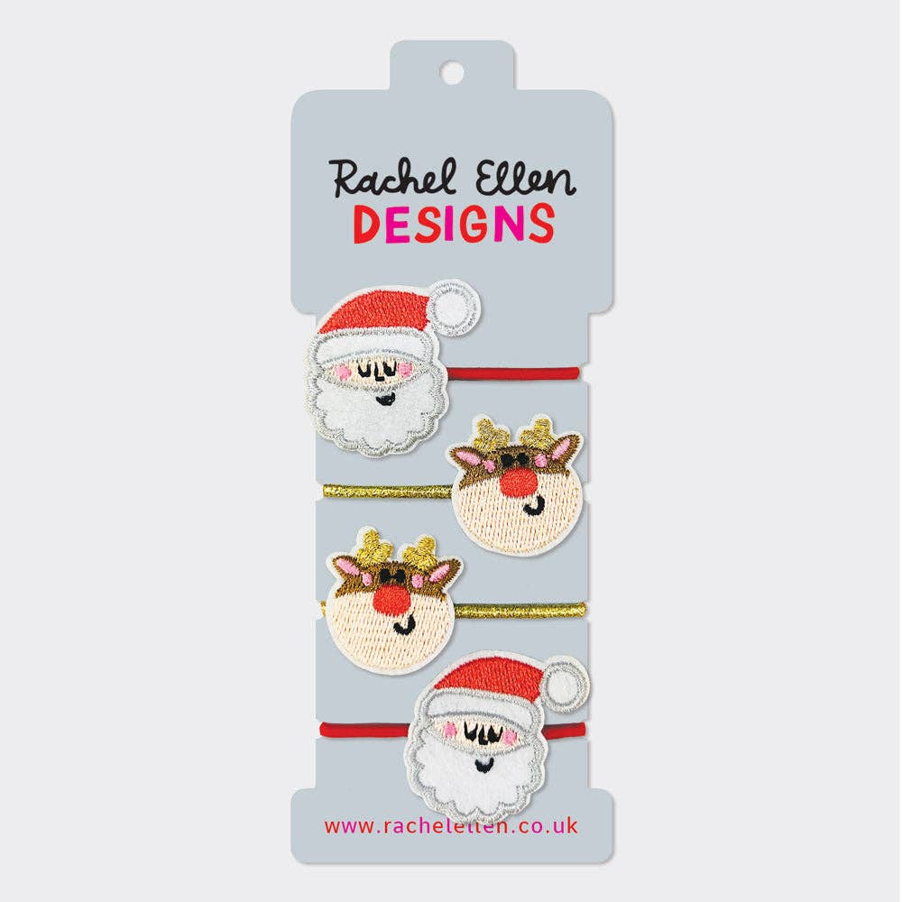 Set of Christmas-themed hair accessories on a Rachel Ellen Designs card.