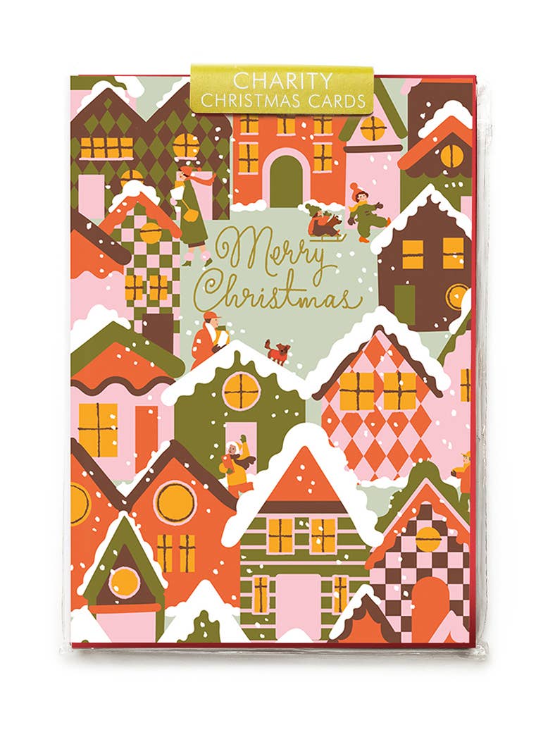 Pack of charity Christmas cards with colorful house illustrations on a white background