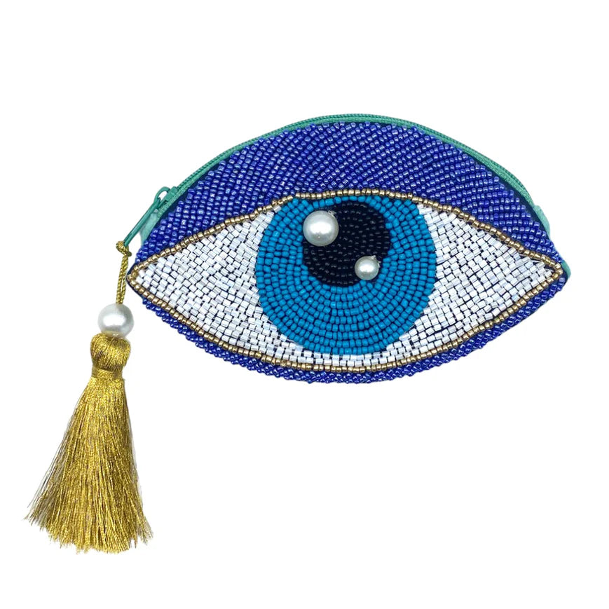 Eye-shaped beaded purse with a tassel on a white background