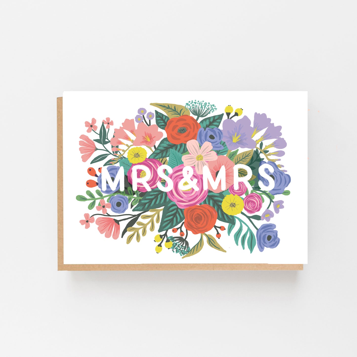 Wedding Card with the words MR & MRS in white in the middle of the card which is displayed landscaped . the words are surrounded by multi coloured flowers. Brown Kraft envelope.