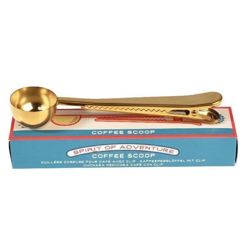 Brass looking coffee spoon the handle acts as a clip too in a cad board box