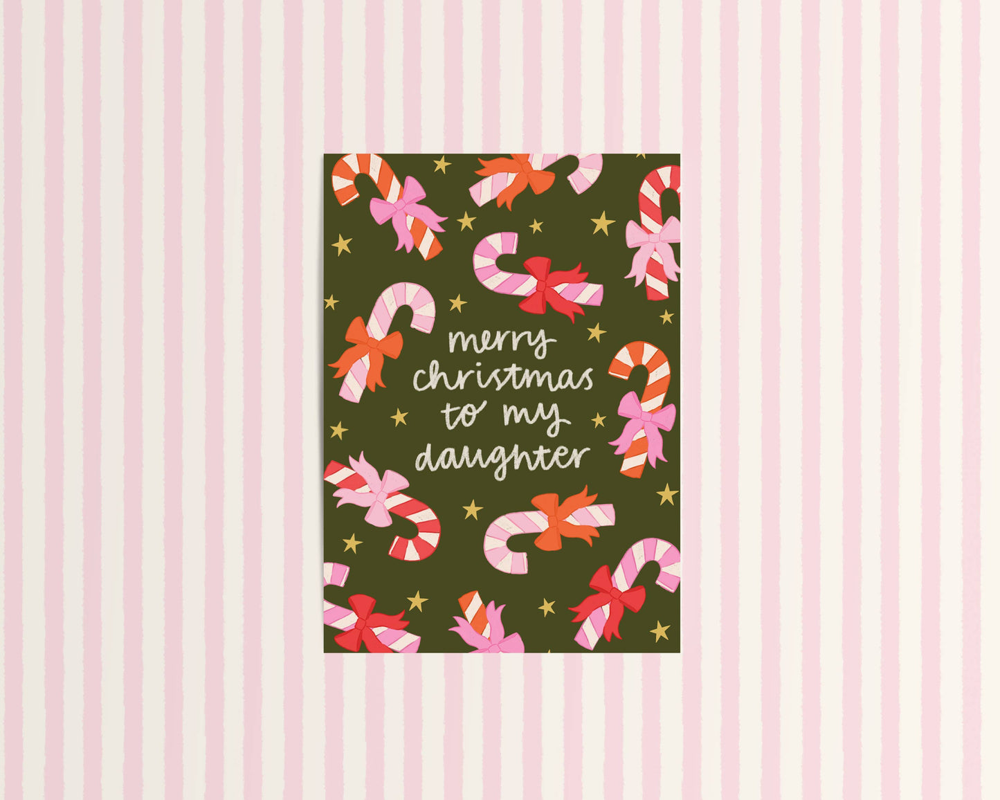 Christmas card with candy canes and bows on a striped background