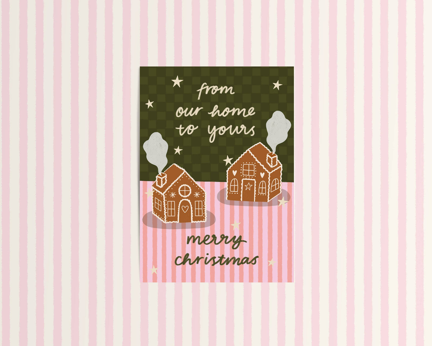 Christmas card with gingerbread houses and text on a pink and green striped background