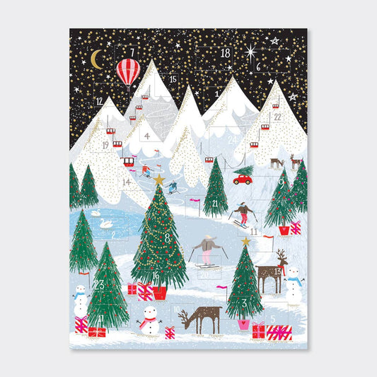 Cardboard A4 Sized advent calendar with mountains Christmas trees snowmen Presents reindeer and cable car on it.