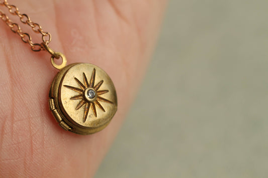 close up image of the unopened compass locket
