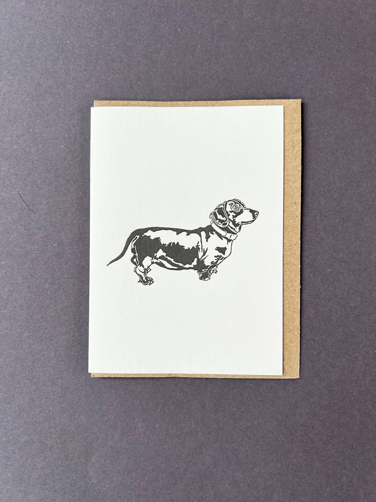 Greeting card with a dachshund illustration on a white background