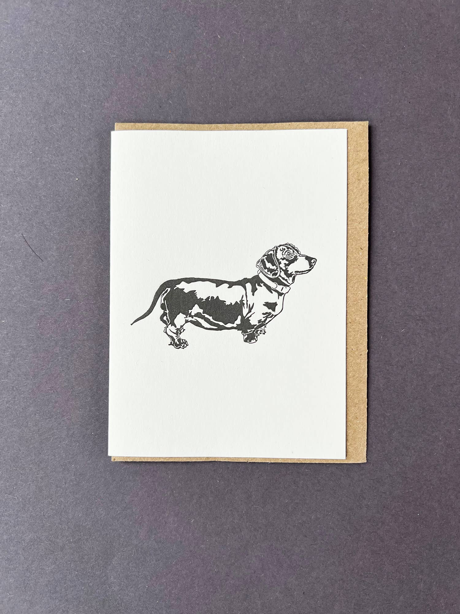 Greeting card with a dachshund illustration on a white background