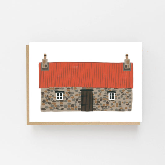 Greeting card featuring a hand drawn image of a scottish bothy building with a red roof. The card is blank inside for your own message and comes with a kraft enevelope.