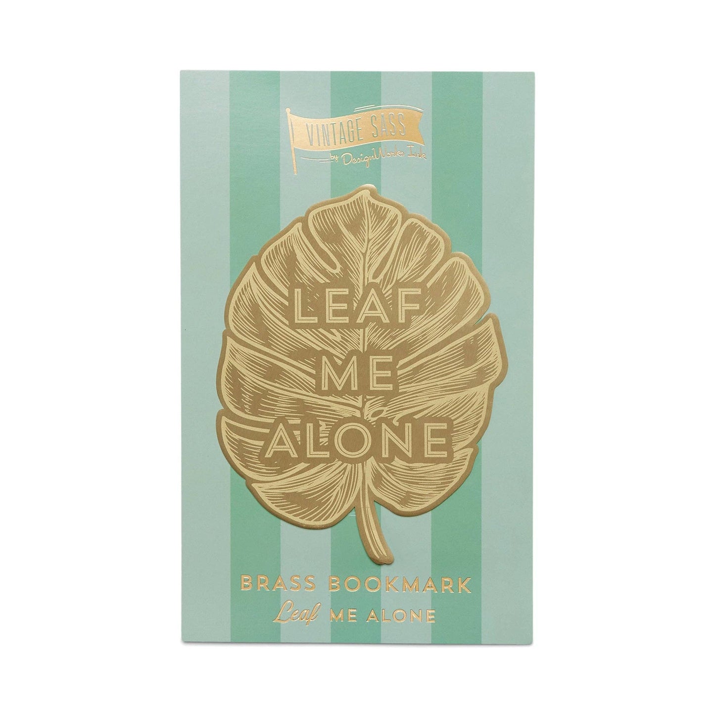 image of a brass bookmark in the shape of a leaf.  etched in the centre of the leaf are the words leaf me alone