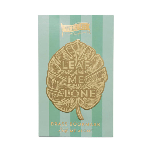 image of a brass bookmark in the shape of a leaf.  etched in the centre of the leaf are the words leaf me alone