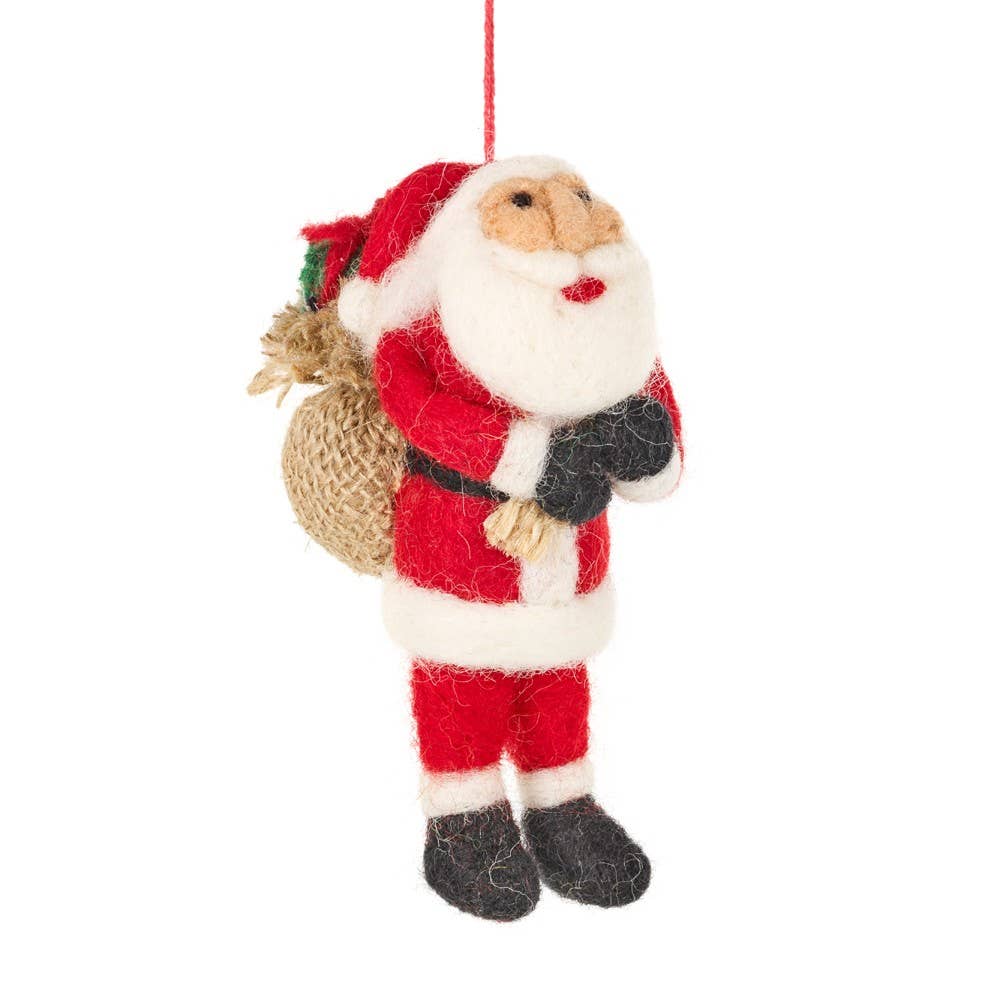 christmas tree hanging decoration of a father christmas carrying a sac of presents on his back