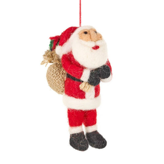 christmas tree hanging decoration of a father christmas carrying a sac of presents on his back