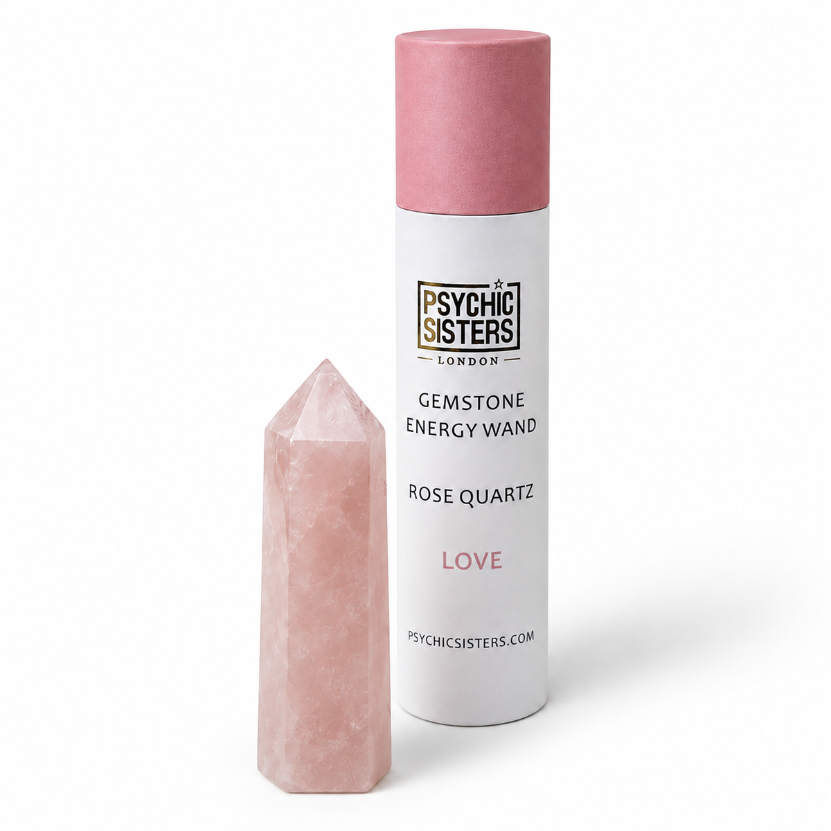 A pink rose quartz gemstone point displayed next to its white and pink cylindrical wand container from Psychic Sisters London, on a clean white background.