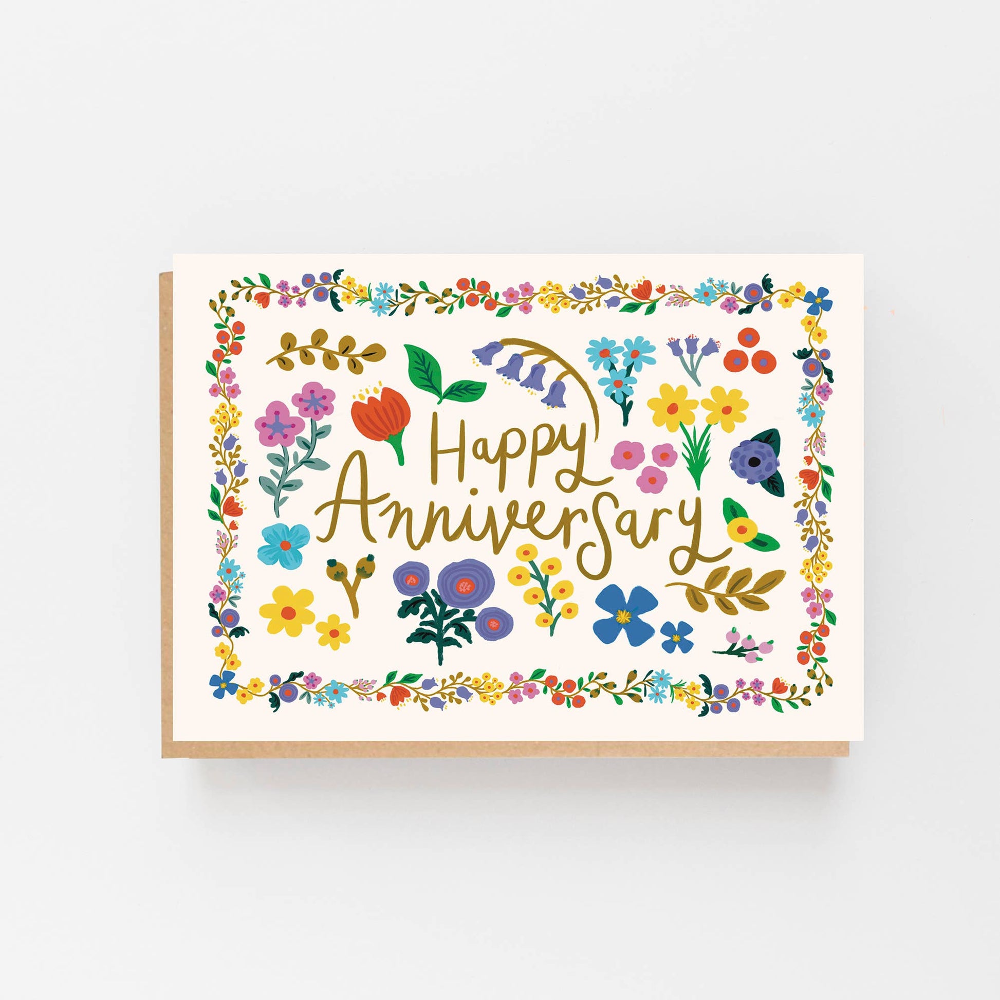 Greeting Card with a bright floral border and in the centre of the border are the words Happy Anniversary surrounded by individual hand drawn flowers. The  card is blank inside for your own message and comes with a Kraft envelope.