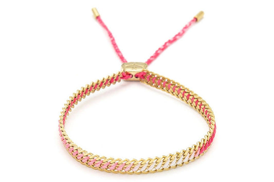 image shows a gold chain bracelet with pink thread running through the centre of each chain. the chain is expandable.both ends of the thread  run through a gold motif to tighten or loosen the bracelet .each end of the thread is in cased in a gold cover. 