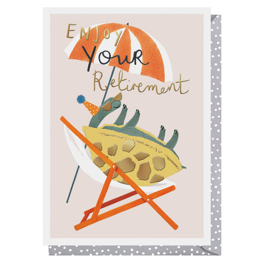 Card with a turtle in a beach chair under an umbrella, text 'Enjoy Your Retirement', on a light pink background.
