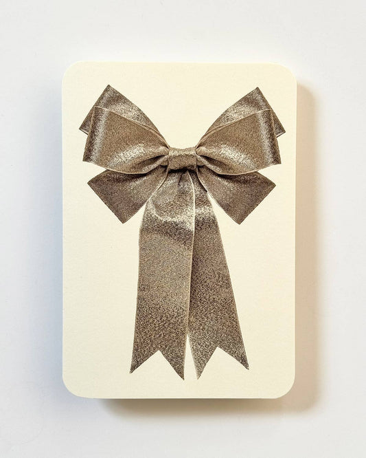 Greetings Card with a Gold Ribbon looking bow on the front. Looks like real material but it is an image  White Background.  White Envelope.