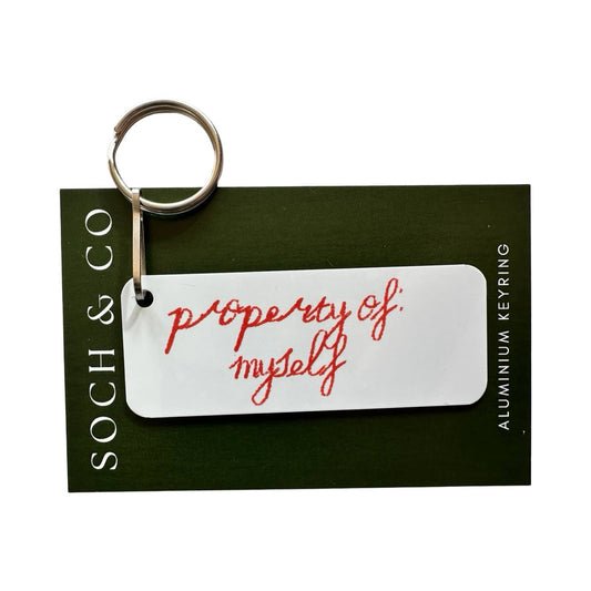 Keychain with 'property of myself' text on a black card, featuring the brand 'SOCH & CO'.