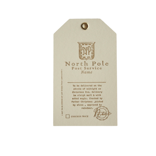 set of 3 ivory christmas gift tags. Each tag has North Pole post service written on it with a blank space to enter a Name 