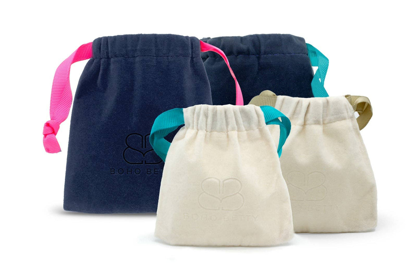 image shows 2 blue velvet drawstring bags one with a teal drawstring and the other with pink.  also shown are 2 smaller gift bags in ivory velvet, one has a teal drawstring the other has a beige drawstring. these bags are for any jewellery purchased from the brand Boho Betty within the jewellery collection