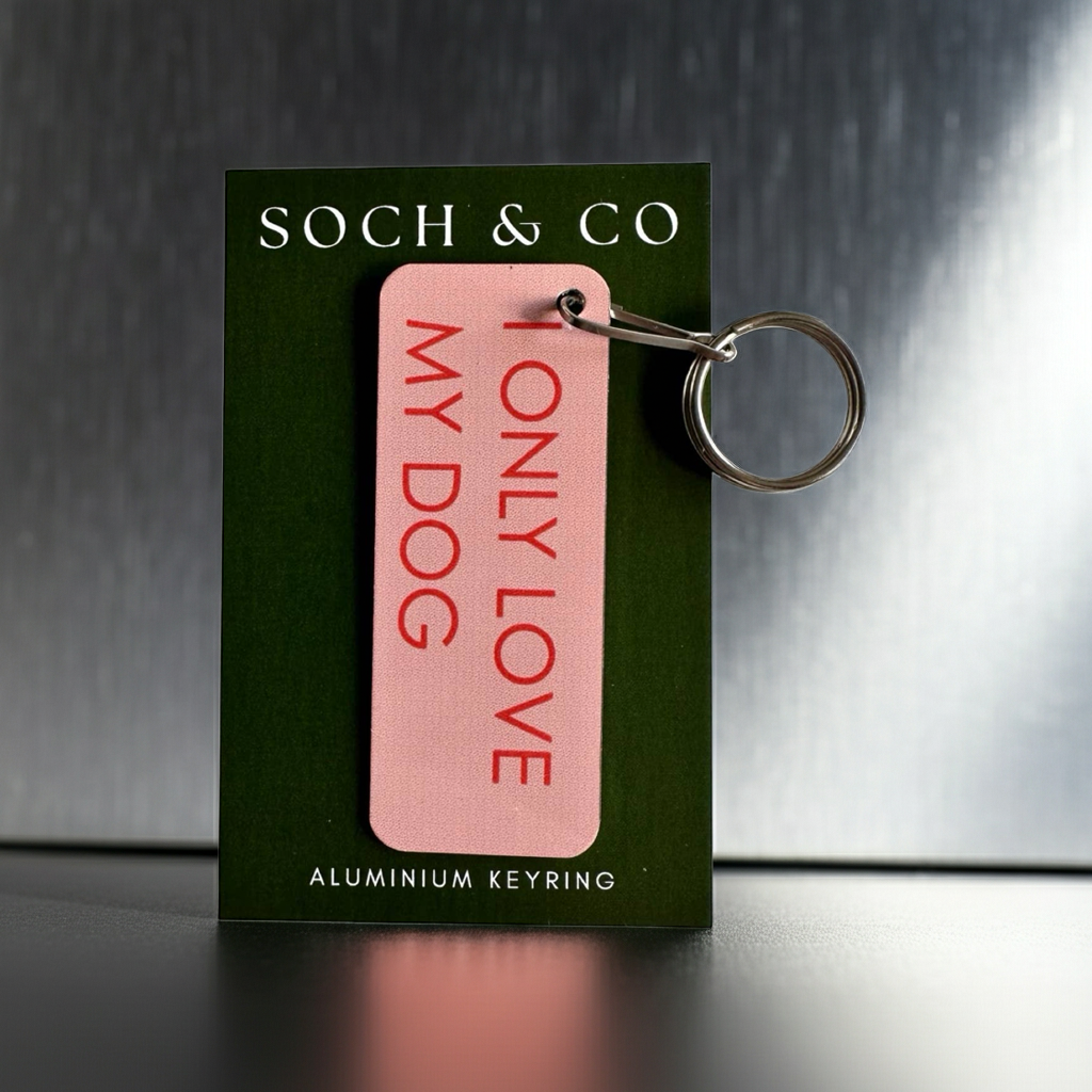 Pink keyring with 'I Only Love My Dog' text on a green card with 'SOCH & CO' branding.