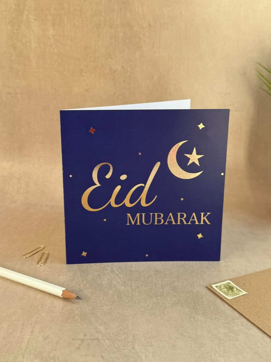 Eid Mubarak card with a moon and star design on a beige background