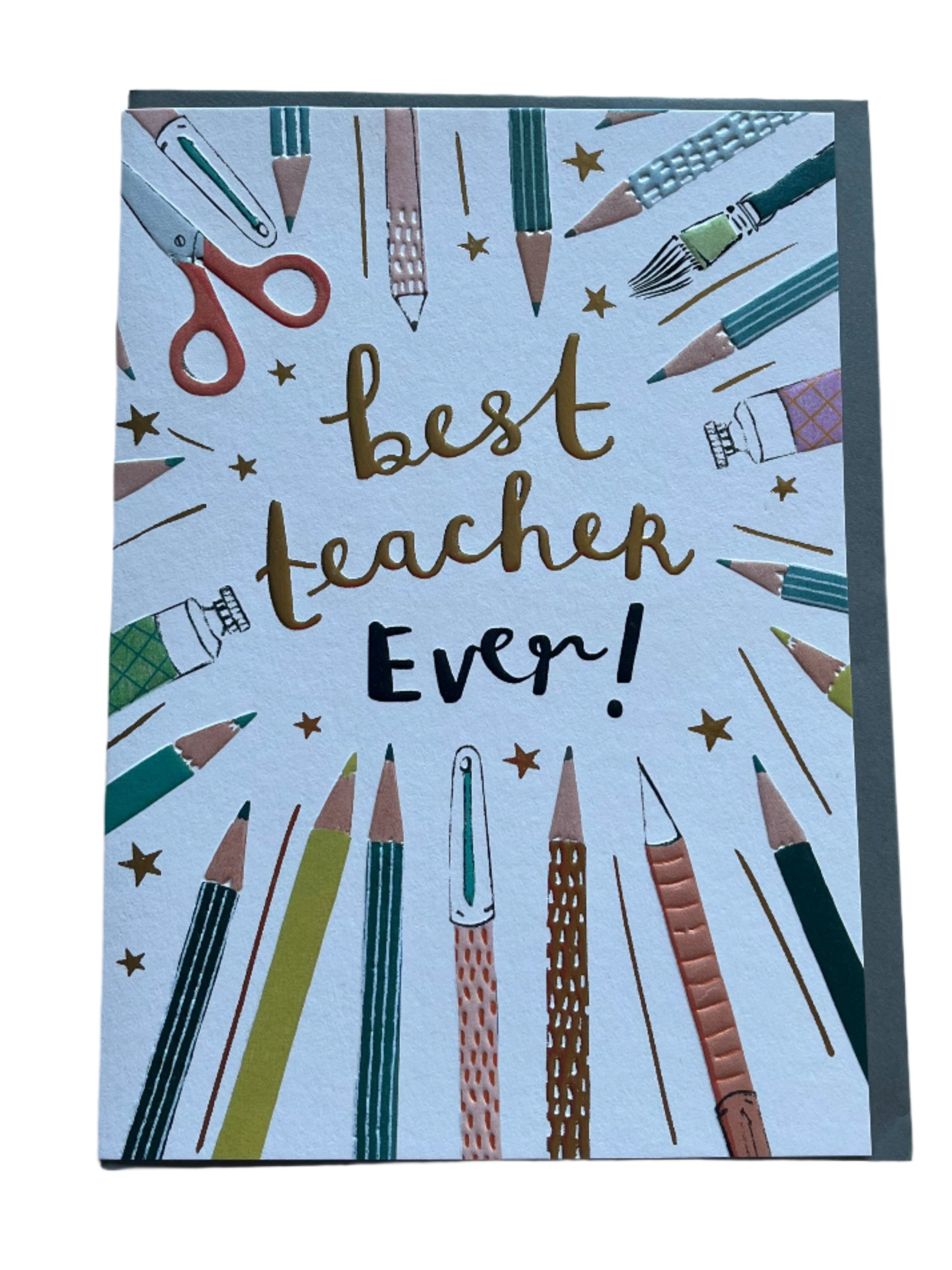 Greeting card with best teacher ever written in the middle with images of pens and pencils around the edge of the card. Blank inside with a grey envelope.
