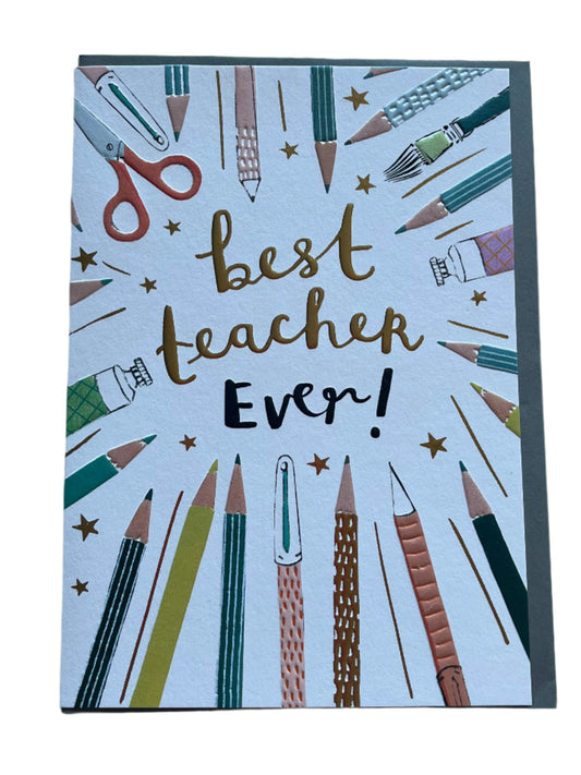 Greeting card with best teacher ever written in the middle with images of pens and pencils around the edge of the card. Blank inside with a grey envelope.