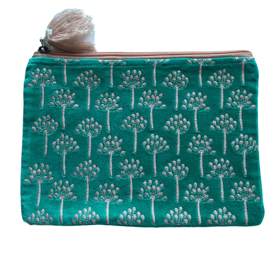 Teal pouch with white floral pattern on a light blue background