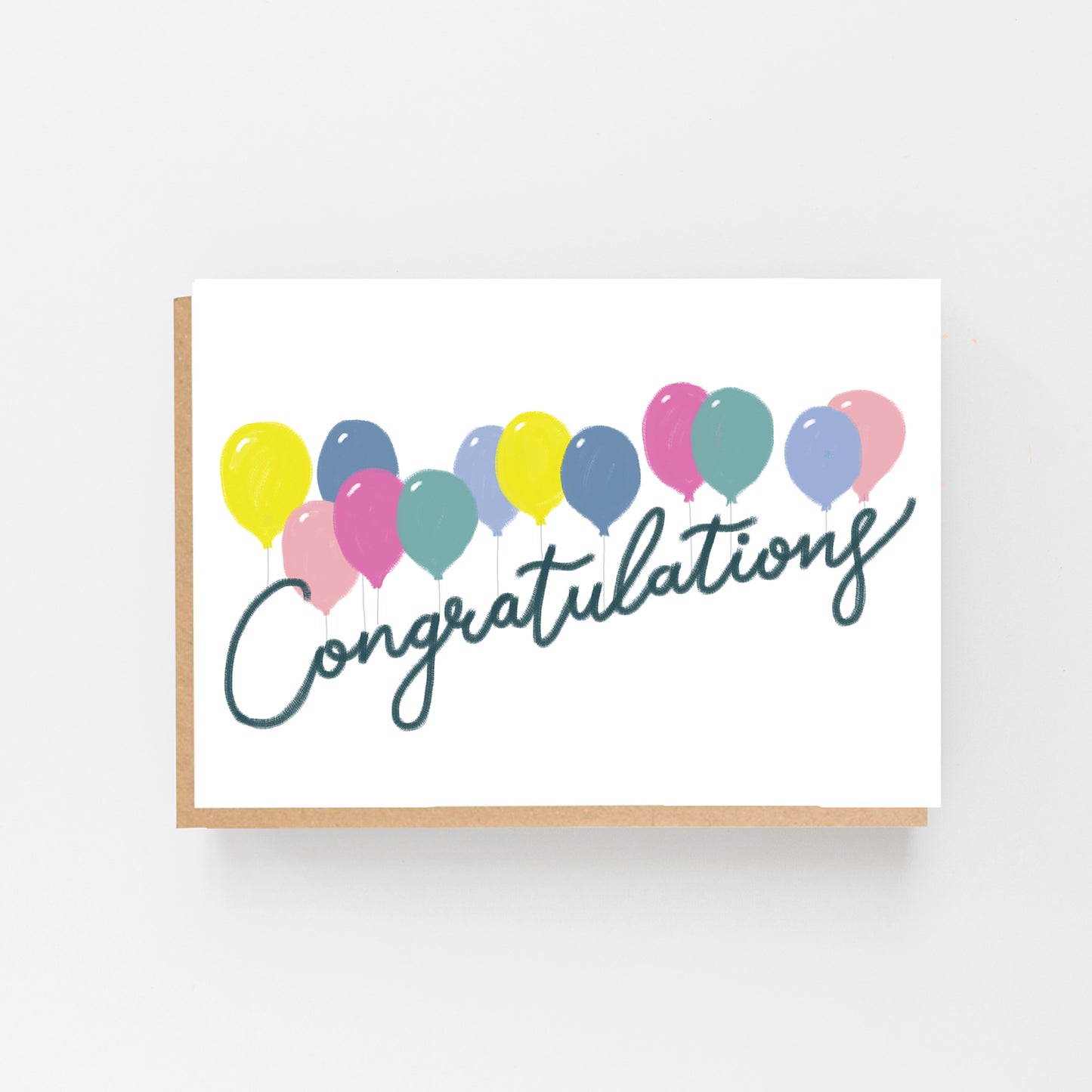 Greeting Card in Landscape with a White Background with a row of pastel coloured balloons all across the centre of the card. With the words Congratulations in black italics. 