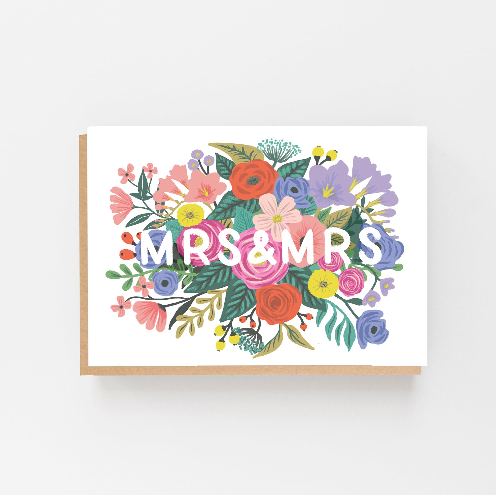 Wedding Card with the words MR & MRS in white in the middle of the card which is displayed landscaped . the words are surrounded by multi coloured flowers. Brown Kraft envelope.