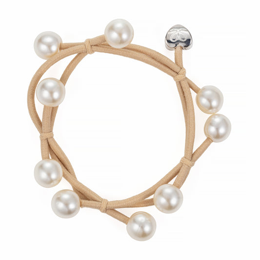 sand coloured hair band decorated with 9 pearls and a silver heart motif