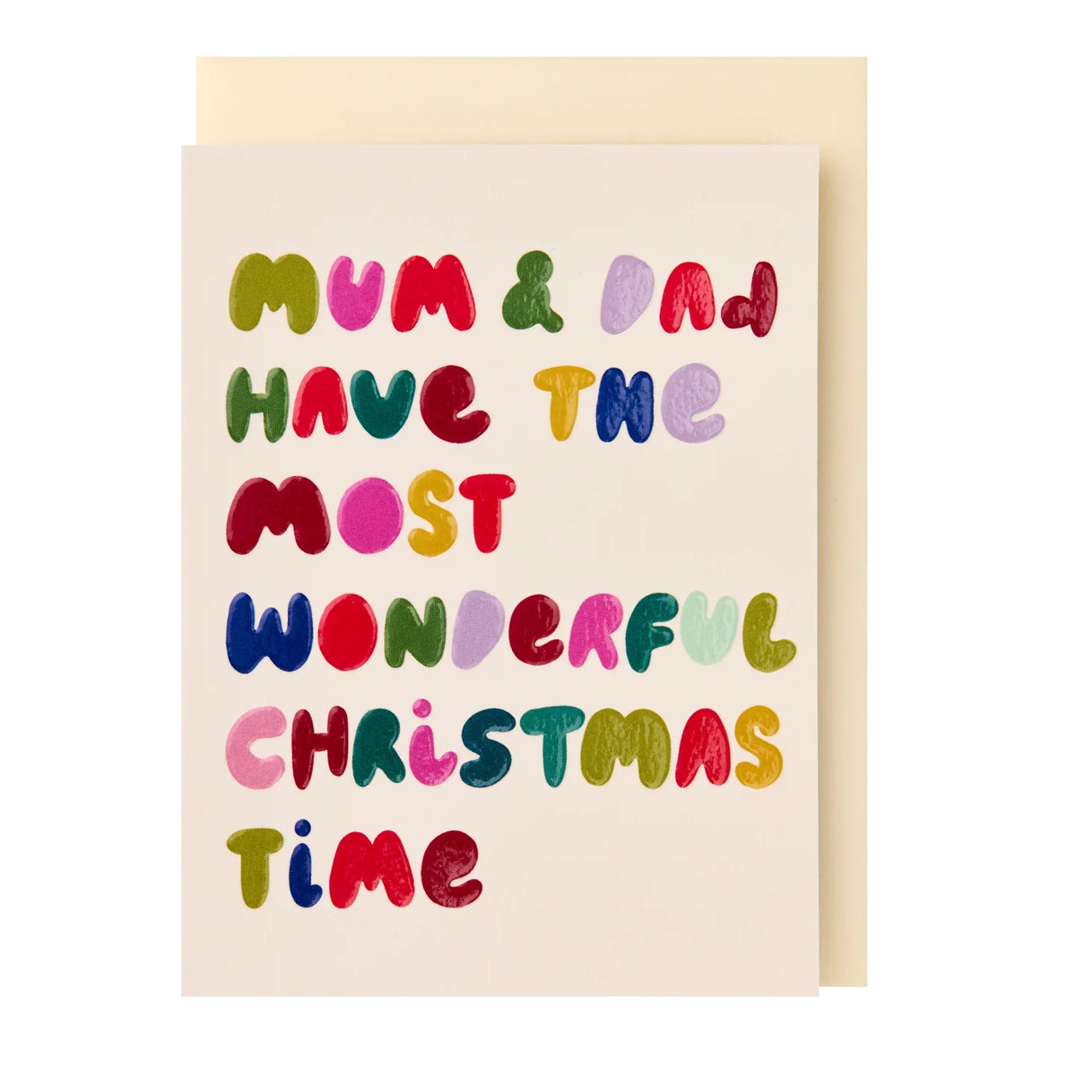 A Christmas greeting card with a cream background and colorful textured lettering that reads 'Mum & Dad Have the Most Wonderful Christmas Time', shown with a light beige envelope behind it on a white background.