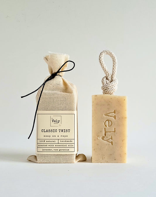 cream soap with cream rope and hessian bag which the soap comes in. The word Vely is etched into the soap. the fragrance is classic twist.