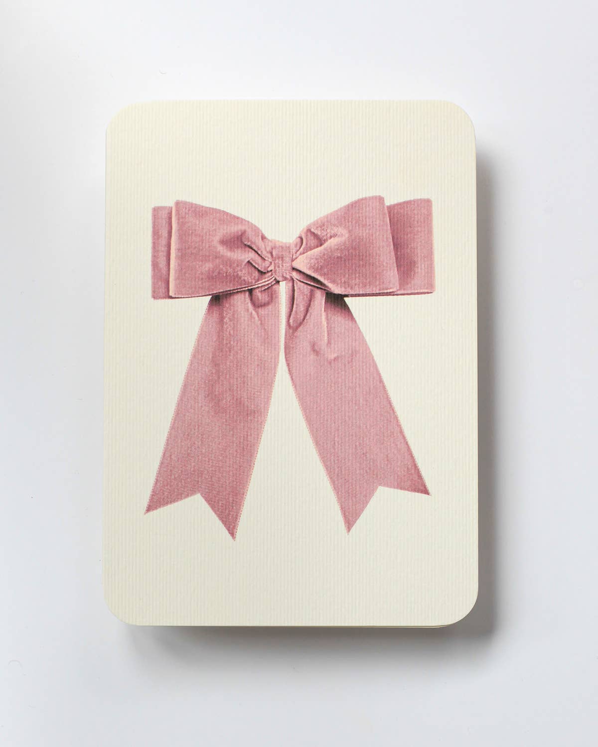 Greetings Card with a Pale Pink Velvet looking Ribbon looking bow on the front.  Looks like real material but it is an image  White Background.  White Envelope