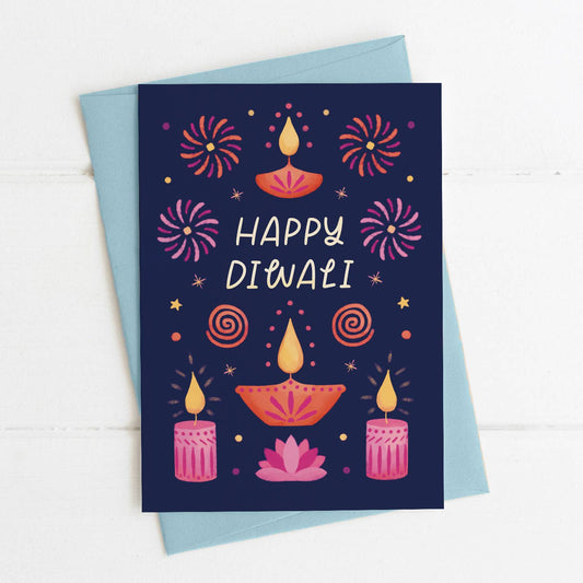A6 card showing fireworks and candles with the word Happy Diwali written in the centre with a pale blue envelope
