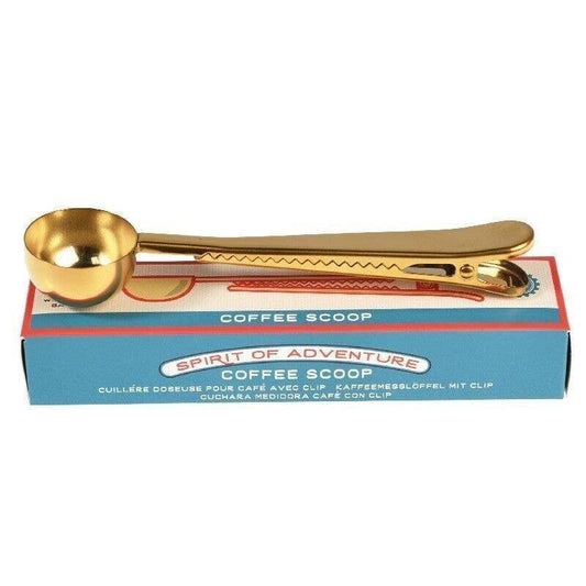 Brass looking coffee spoon the handle acts as a clip too in a cad board box