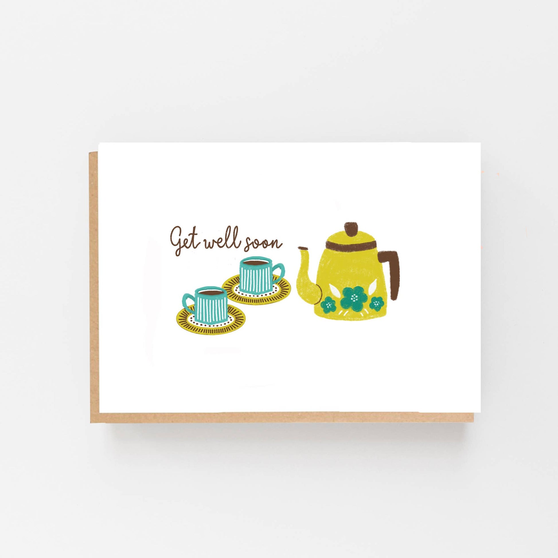Greeting card  featuring a hand drawn Kettle alongside 2 cups and saucers. Above the cups  are the words Get Well Soon. The card is blank inside for your own message and comes with a kraft envelope.