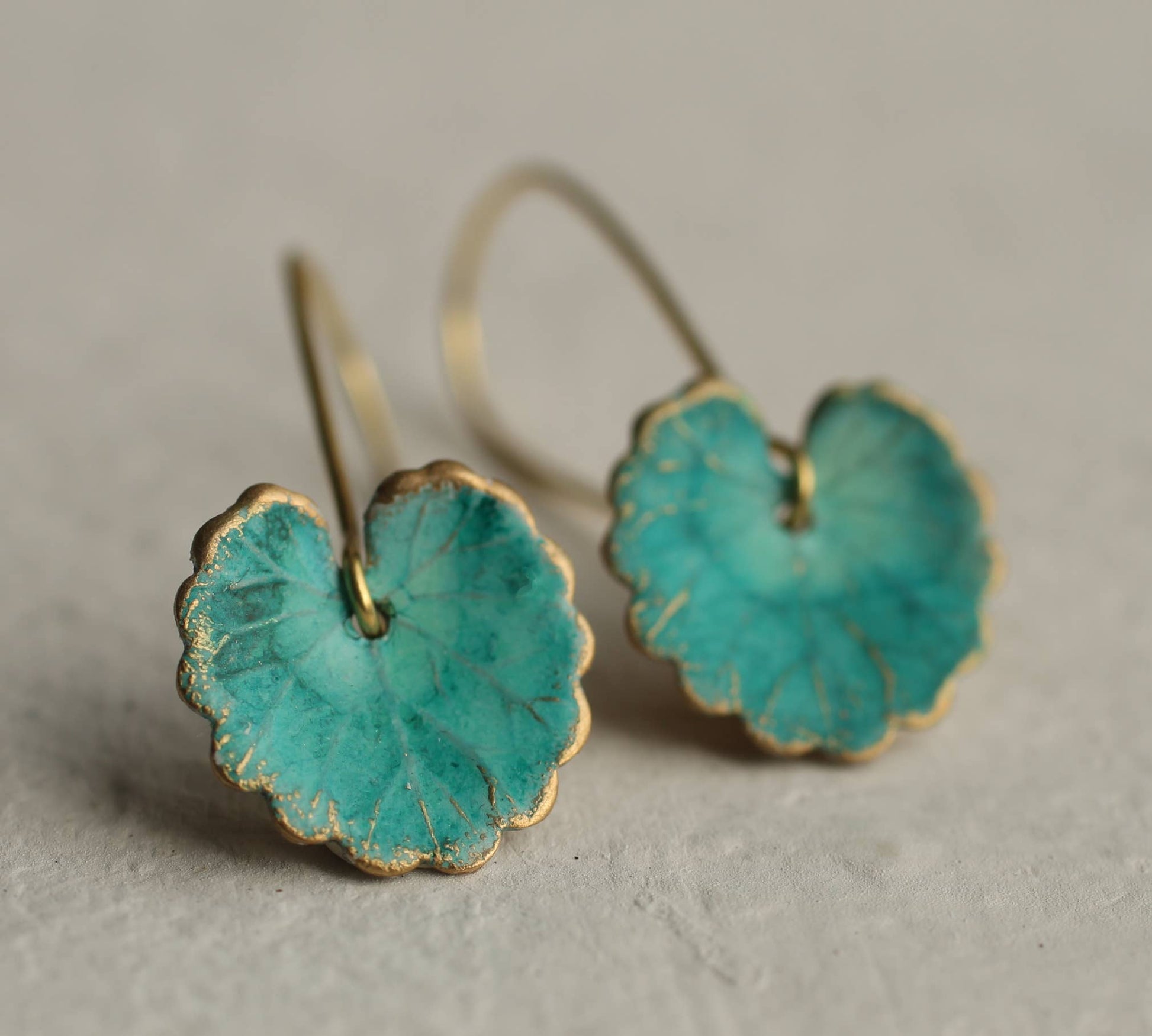 close up image of the pair of turquoise leaf earrings