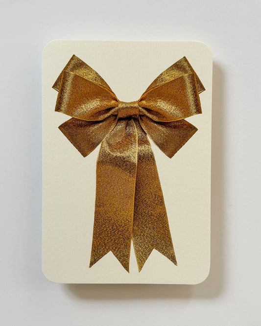 Greetings Card with a Gold Ribbon looking bow on the front. Looks like real material but it is an image  White Background.  White Envelope.