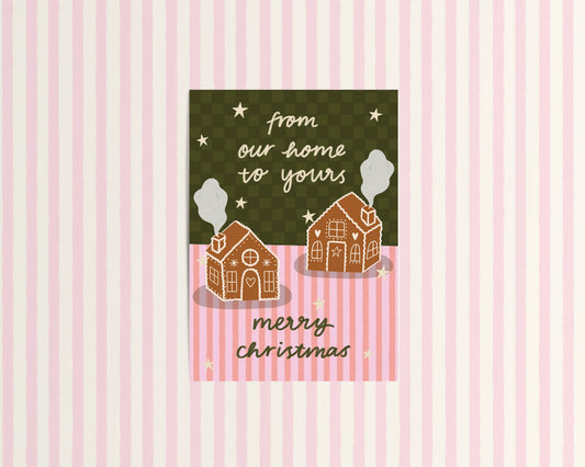 Christmas card with gingerbread houses and text on a pink and green striped background
