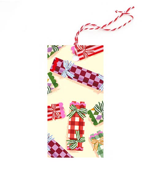 Decorative gift tag with checkered ribbons and bows on a yellow background