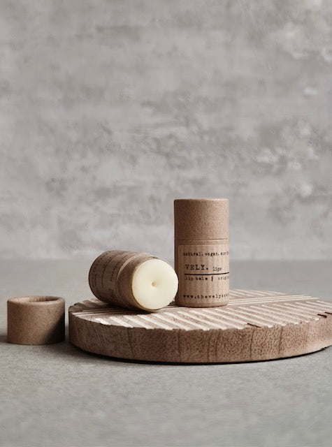 Unscented mini lip balm in a push up cardboard tube. Vegan friendly, clear in colour on lips